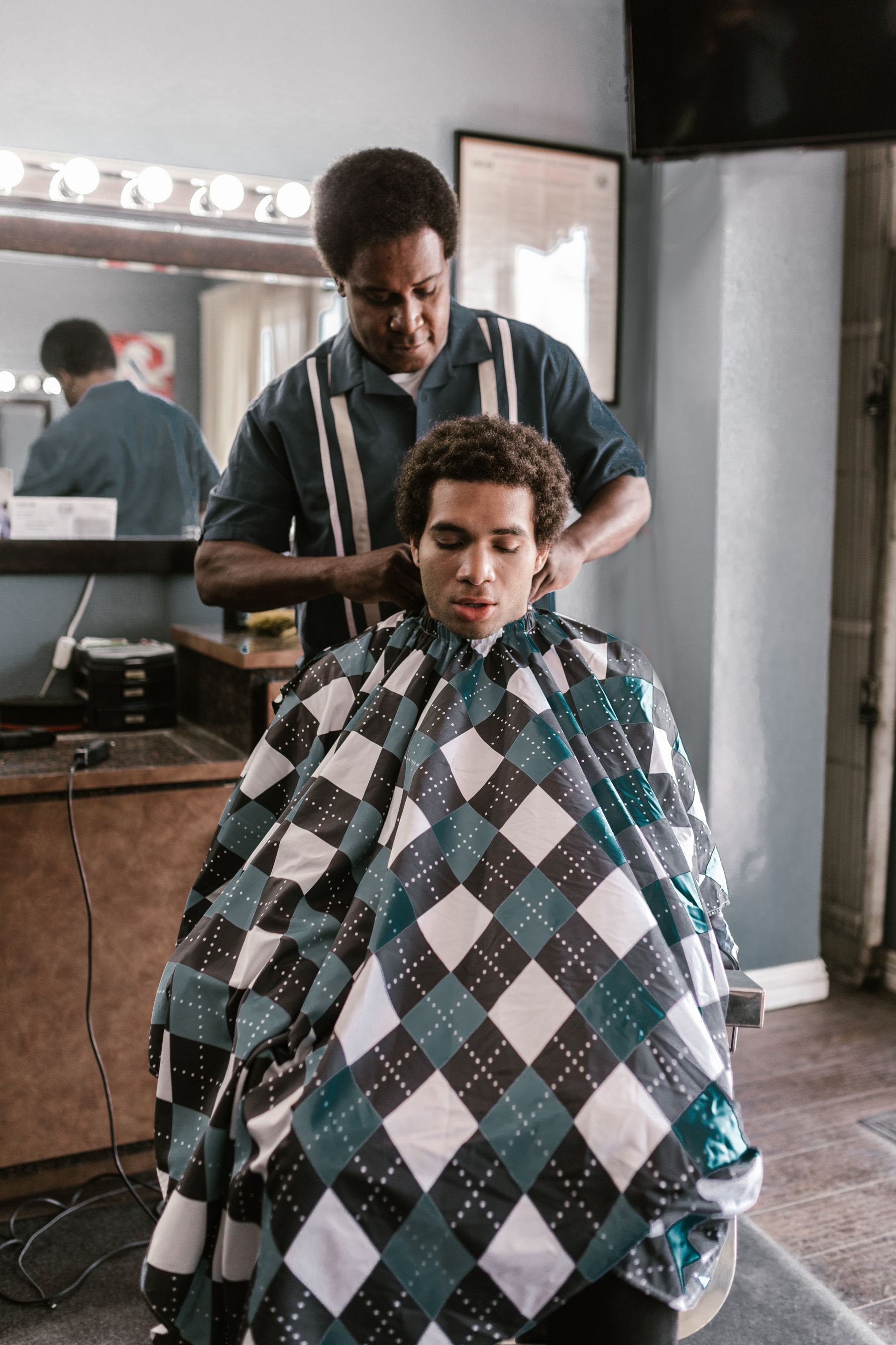 Barber cutting a client's hair