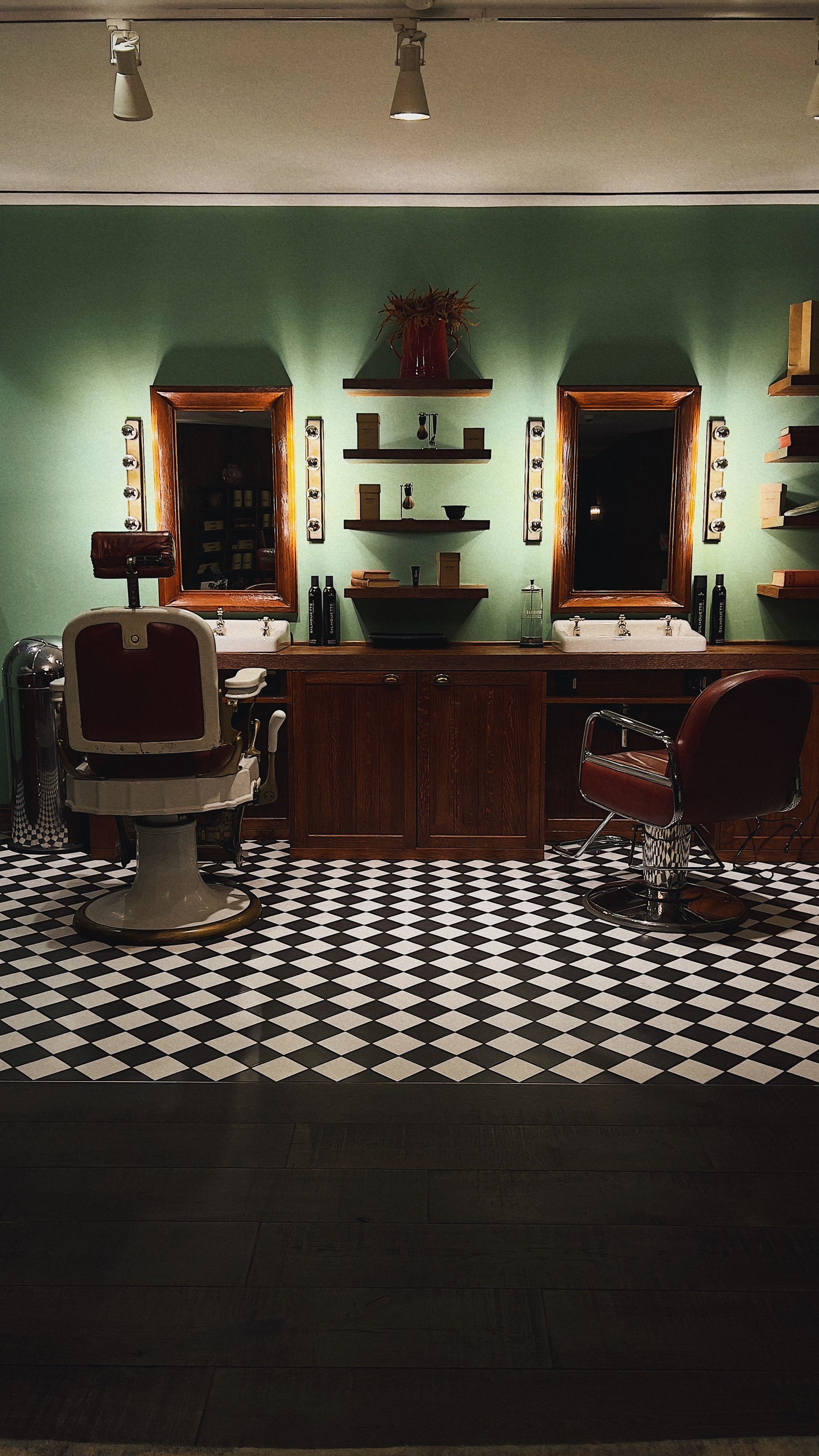 Barbershop interior with leather chairs and mirrors